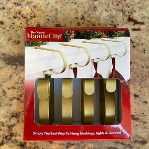 Four gold mantle clips